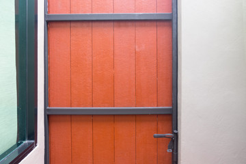 Wooden vintage painted orange door
