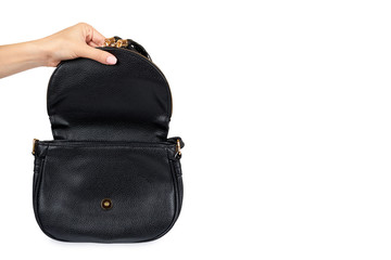 Naklejka premium Black leather shoulder bag with hand isolated on a white background , copy space template.