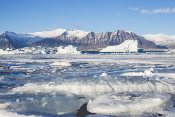 Fototapeta na wymiar Beautiful cold winter landscape with icebergs in Jökulsárlón glacial lagoon, Vatnajökull National Park, southeast of Iceland, Europe.