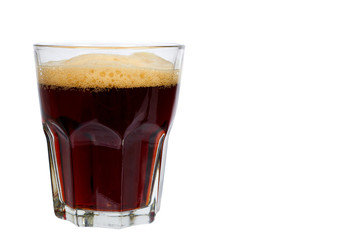 Cold glass of dark beer or kvass with foam isolated on white background, copy space template.