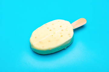 white popsicle on blue background