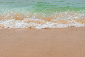 soft wave of an ocean on a sandy beach