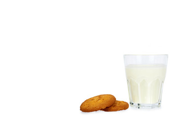Glass of milk and homemade cookies isolated on white background, copy space template