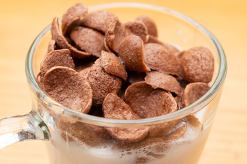 cup of milk with cereal slices as healthy eating