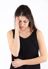 Fototapeta premium Sad emotional girl on a light background