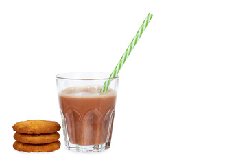 Glass of chocolate milk cocoa and straw with homemade cookies isolated on white background, copy space template