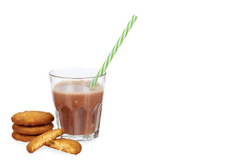 Glass of chocolate milk cocoa and straw with homemade cookies isolated on white background, copy space template