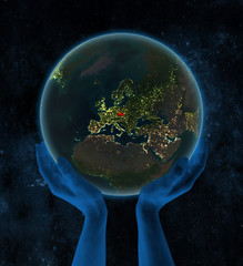 Czech republic on night Earth in hands in space