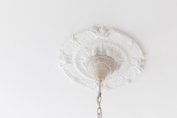 Decoration lighting lamp with molding item white plaster. Relief stucco interior