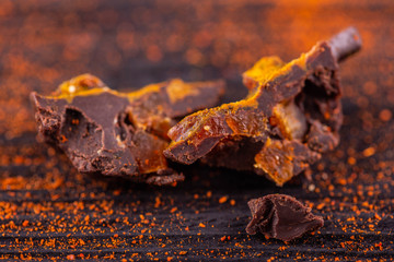 Chocolate in a section with pieces of dried apricots and a turmeric