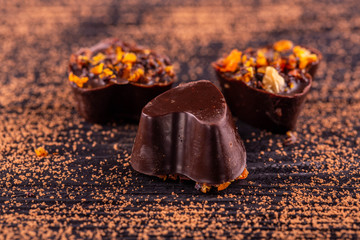 Candies in the form of a heart with pieces of dried fruits