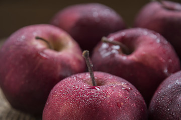 Fresh organic ripe apple fruits on old wooden table.