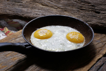 Fried eggs in frying pan