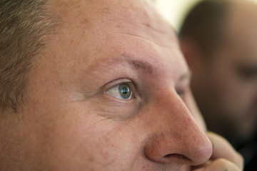 Thoughtful young man thinking, closeup