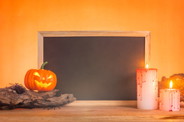 rectangle blank slate or chalkboard with wooden frame decorate with halloween objects, mist floating all around