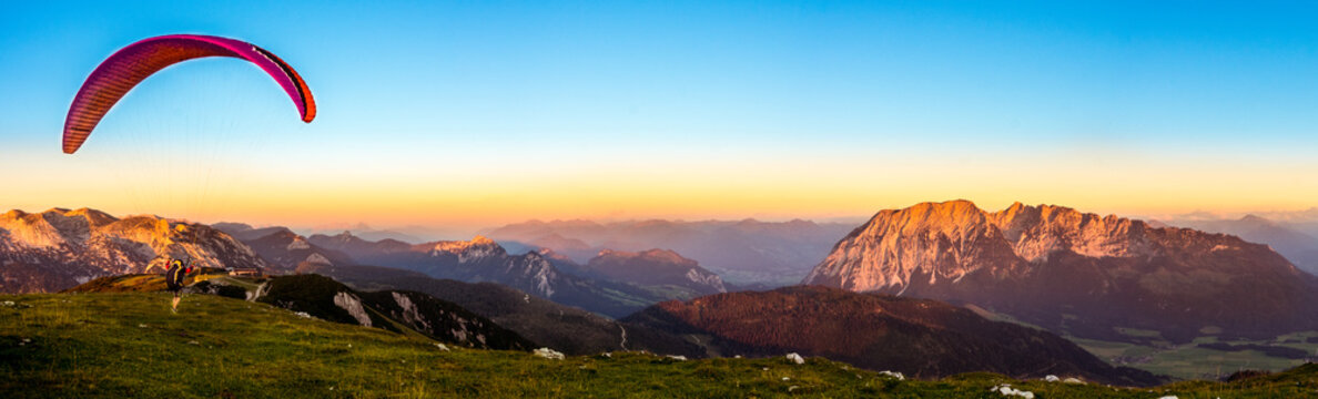A Paraglider starts on the Lawinenstein to the Grimming. You have a beautiful view to Bad Mitterndorf in Salzkammergut Austria. 