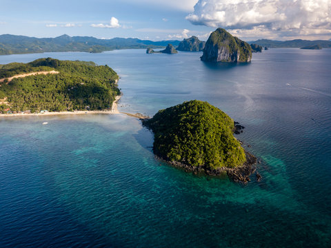 Aerial drone view of limestone islands and coral reef in the Bacuit Archipelago