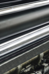 Closeup of printng machine working part with white light