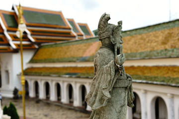 Obraz premium Nakhon Pathom / Thailand - August 26 2018: Chinese Warrior Stone Statues stand in Thai temple at Wat Phra Pathom Chedi(Big pagoda)