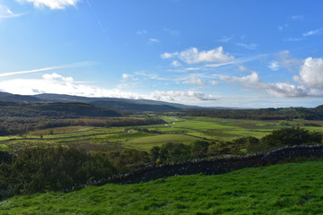 View into a valley full of fields