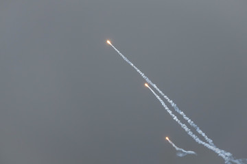 Decoy flare rockets from fighter jet. Countermeasure. Background with copy space.