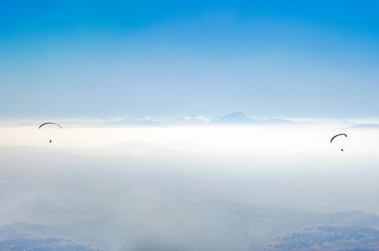 paragliding in nepal with himalaya view and clear blue sky