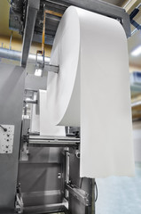 Roll of Paper in Printing machine, Newspaper roto production line in Print shop. Rolled Up,...