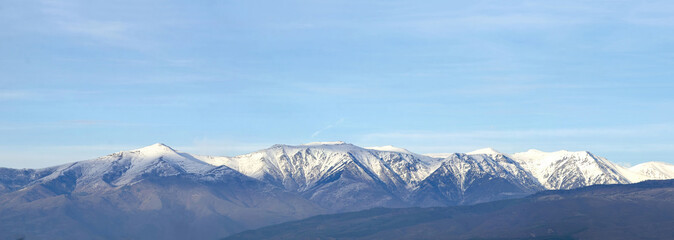 Panorama of Snow Mountain Range Landscape with Blue Sky