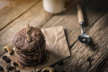 freshly baked chocolate chip cookies on rustic wooden table
