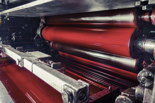 print machine, red magenda color drum, dramatic light