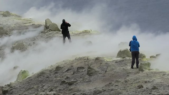 hiking on sulfur fumaroles on the crater of Vulcano, Aeolian Islands, Sicily
