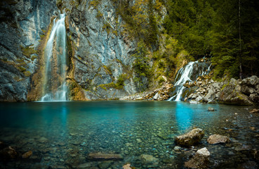 a colorful Waterfall in the alps 