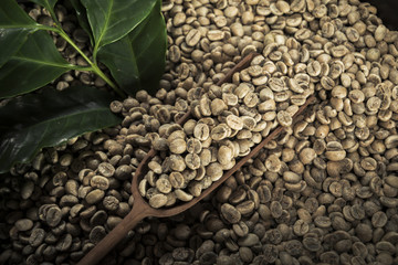 Cup of coffee, bag and scoop on old rusty background