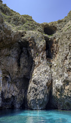 Promontory with cavities of prehistoric age, in some caves have been found prehistoric objects, which leads directly to the sea. San Maria di Leuca, Italy