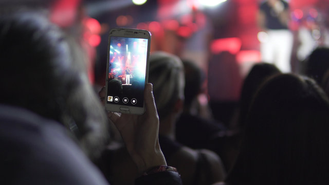 Recording, taking pictures with smart phone on concert.  Public concert, NO TICKETING EVENT