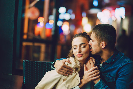 Couple Drinking Coffee Outside