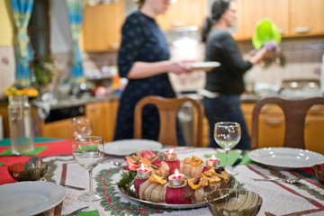 Advent wreath on the Christmas table in the Christmas eve.