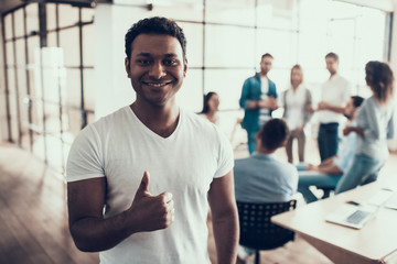 Portrait of Young Smiling Businessman in Office