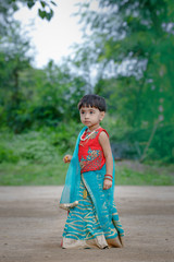 Little Indian girl child with lord ganesha and praying , Indian ganesh festival