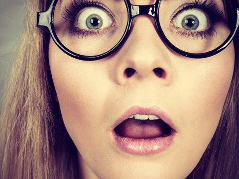 Closeup woman shocked face with eyeglasses
