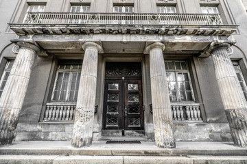 Greek pillar building with weathered windows