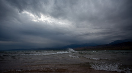 Stone in the water, Mountain lake, Issyk-Kul, Kyrgyzstan