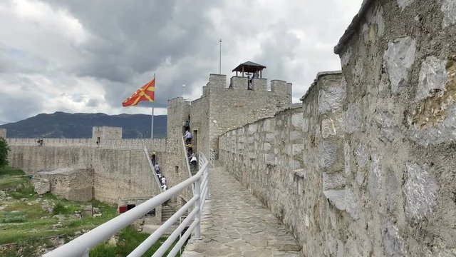 Cinematic walking pov on wals of famous old fortress ruins of tzar Samuel in Ohrid know as Samuels fortress with Lake Ohrid in the background. Ohrid - Macedonia