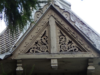 Fragment of a beautiful old wooden summer house with carvings