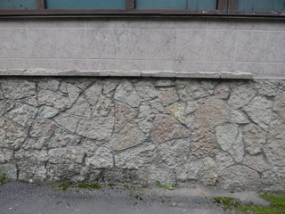 Wall from a gray rough stone as a background