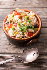 Traditional italian rice salad on wood table