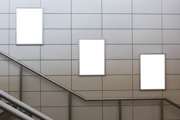 Three big vertical / portrait orientation blank billboard with stairs background