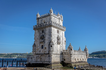 Fototapeta na wymiar Lisbon, Portugal - May 8th 2018 - Tourists and locals enjoying a blue sky afternoon in the Belem Tower, heritage site of Unesco in Lisbon, Portugal