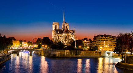 Picturesque panorama of Cathedral of Notre Dame de Paris at sunset, France