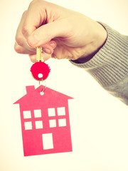 Key ring with house pendant.